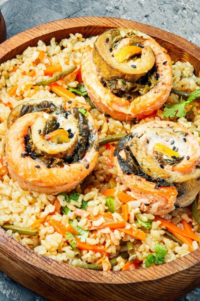 Discover 25 delicious salmon and rice recipes perfect for lunch or dinner! From zesty bowls to sweet and savory classics, these quick and healthy meals are sure to impress. Canned Salmon Fried Rice Recipes, Rice Recipes For Dinner Salmon, Salmon Rice Bowl Recipes Mango, Quick Salmon And Rice Recipes, Salmon And Rice Recipes Healthy, Grilled Salmon Recipes With Rice, Jasmine Rice And Salmon Recipes, Salmon Avocado Recipes Rice Bowls, White Rice And Salmon Recipes, Salmon Recipe With Cilantro Lime