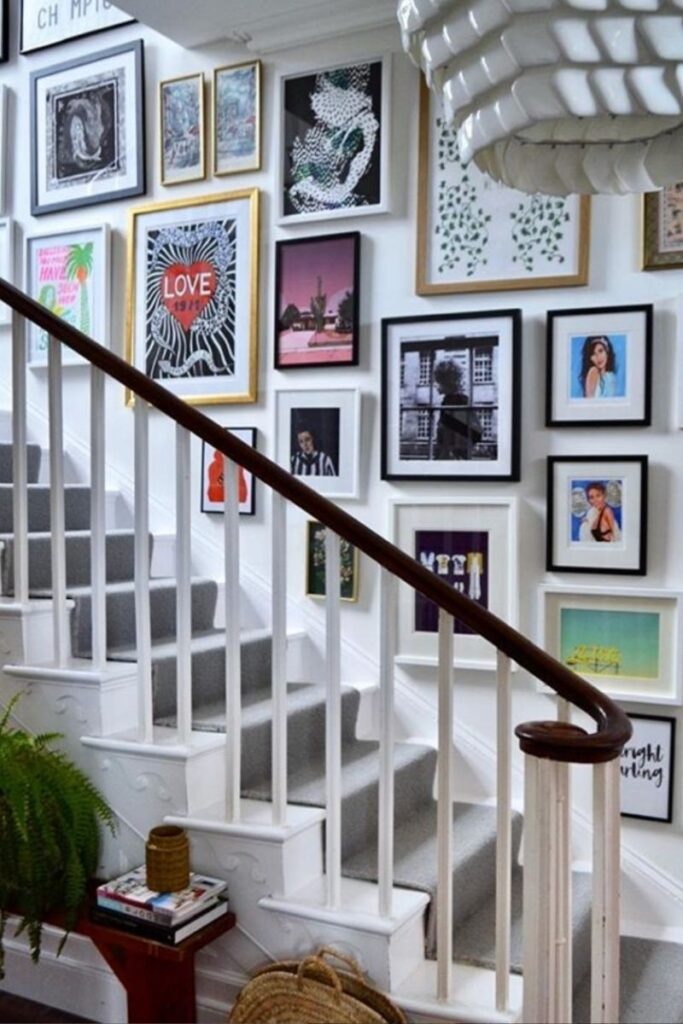 Create a stunning eclectic gallery wall with our expert tips on layout, art selection, and styling. Discover unique ideas for staircases, living rooms, and more to curate a bold and personal display! Eclectic Gallery Wall Ideas, Eclectic Gallery Wall Over Couch, Living Room Gallery Wall, Eclectic Gallery Wall Around Tv, Eclectic Gallery Wall Over Sofa, Inspiration, Colorful, Eclectic Gallery Wall Entryway, Eclectic Gallery Wall Hallway, Mixed Art Styles, Stairs, Wall Paintings, Tips, Layout