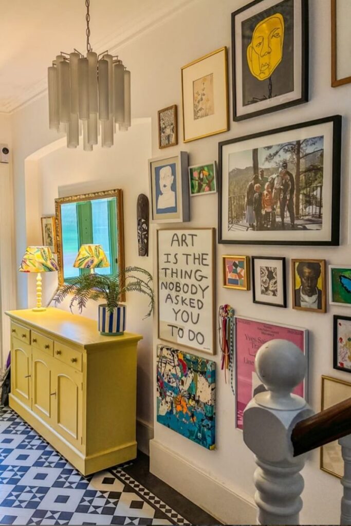 Create a stunning eclectic gallery wall with our expert tips on layout, art selection, and styling. Discover unique ideas for staircases, living rooms, and more to curate a bold and personal display! Eclectic Gallery Wall Ideas, Eclectic Gallery Wall Over Couch, Living Room Gallery Wall, Eclectic Gallery Wall Around Tv, Eclectic Gallery Wall Over Sofa, Inspiration, Colorful, Eclectic Gallery Wall Entryway, Eclectic Gallery Wall Hallway, Mixed Art Styles, Stairs, Wall Paintings, Tips, Layout