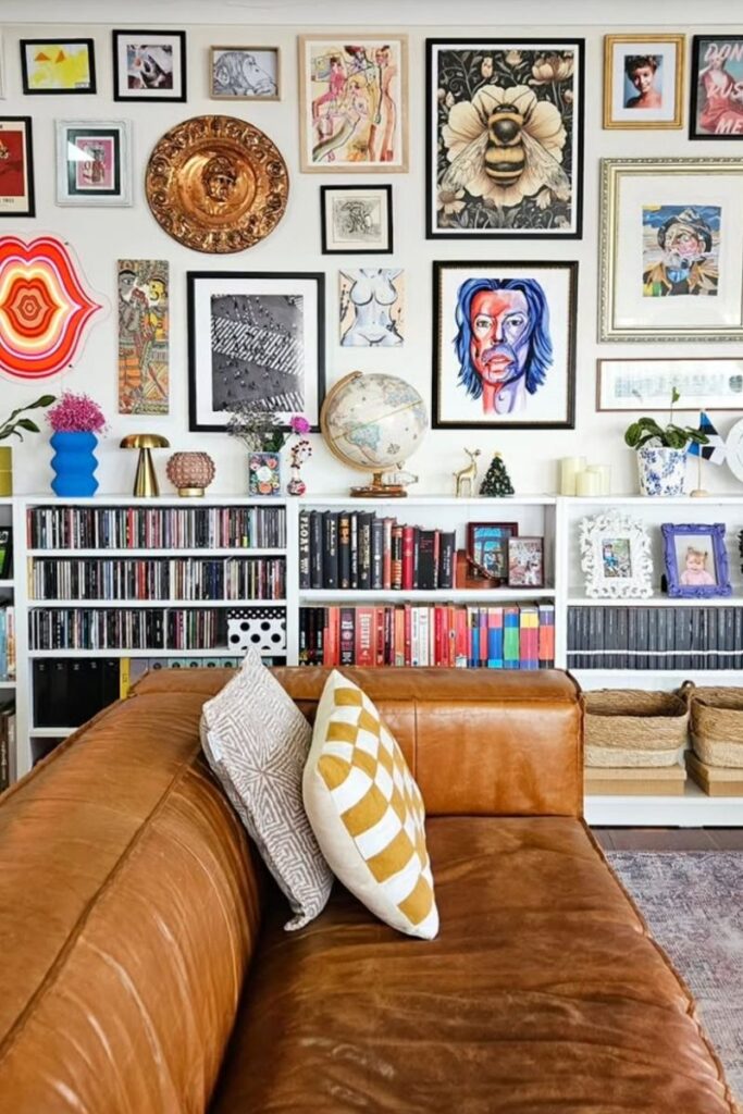 Create a stunning eclectic gallery wall with our expert tips on layout, art selection, and styling. Discover unique ideas for staircases, living rooms, and more to curate a bold and personal display! Eclectic Gallery Wall Ideas, Eclectic Gallery Wall Over Couch, Living Room Gallery Wall, Eclectic Gallery Wall Around Tv, Eclectic Gallery Wall Over Sofa, Inspiration, Colorful, Eclectic Gallery Wall Entryway, Eclectic Gallery Wall Hallway, Mixed Art Styles, Stairs, Wall Paintings, Tips, Layout