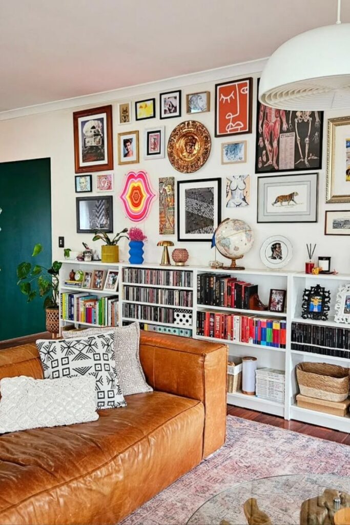 Create a stunning eclectic gallery wall with our expert tips on layout, art selection, and styling. Discover unique ideas for staircases, living rooms, and more to curate a bold and personal display! Eclectic Gallery Wall Ideas, Eclectic Gallery Wall Over Couch, Living Room Gallery Wall, Eclectic Gallery Wall Around Tv, Eclectic Gallery Wall Over Sofa, Inspiration, Colorful, Eclectic Gallery Wall Entryway, Eclectic Gallery Wall Hallway, Mixed Art Styles, Stairs, Wall Paintings, Tips, Layout