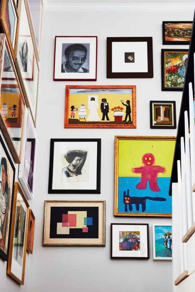 Create a stunning eclectic gallery wall with our expert tips on layout, art selection, and styling. Discover unique ideas for staircases, living rooms, and more to curate a bold and personal display! Eclectic Gallery Wall Ideas, Eclectic Gallery Wall Over Couch, Living Room Gallery Wall, Eclectic Gallery Wall Around Tv, Eclectic Gallery Wall Over Sofa, Inspiration, Colorful, Eclectic Gallery Wall Entryway, Eclectic Gallery Wall Hallway, Mixed Art Styles, Stairs, Wall Paintings, Tips, Layout