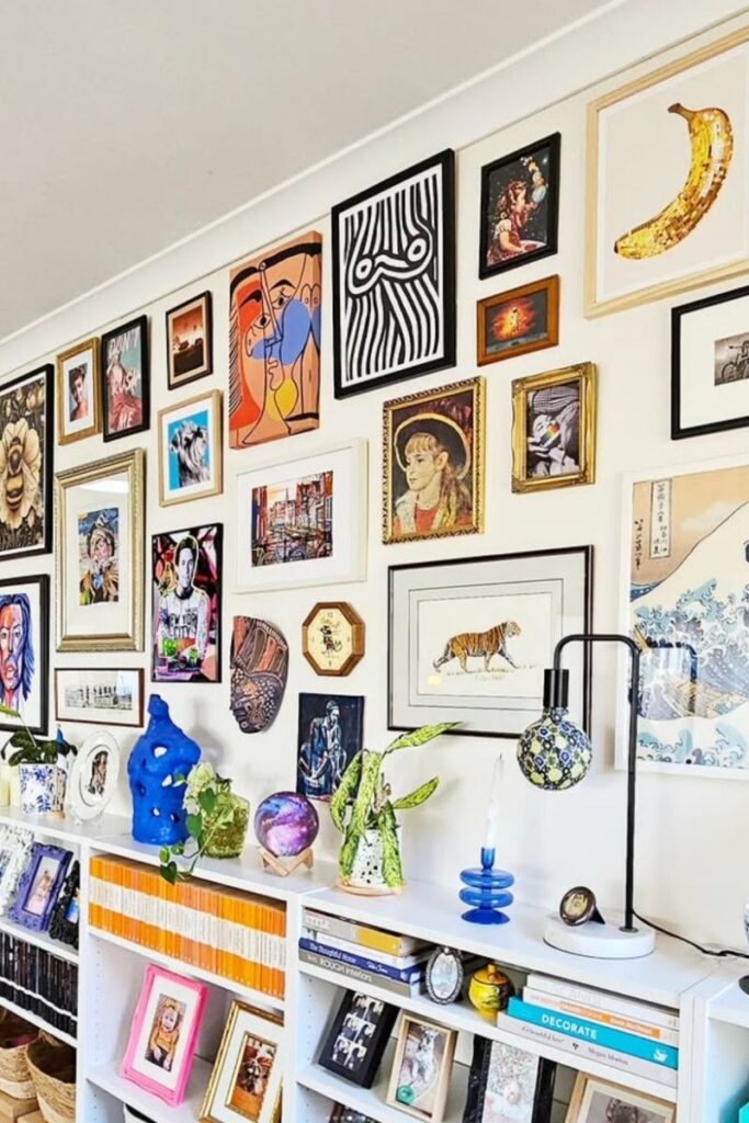 Create a stunning eclectic gallery wall with our expert tips on layout, art selection, and styling. Discover unique ideas for staircases, living rooms, and more to curate a bold and personal display! Eclectic Gallery Wall Ideas, Eclectic Gallery Wall Over Couch, Living Room Gallery Wall, Eclectic Gallery Wall Around Tv, Eclectic Gallery Wall Over Sofa, Inspiration, Colorful, Eclectic Gallery Wall Entryway, Eclectic Gallery Wall Hallway, Mixed Art Styles, Stairs, Wall Paintings, Tips, Layout