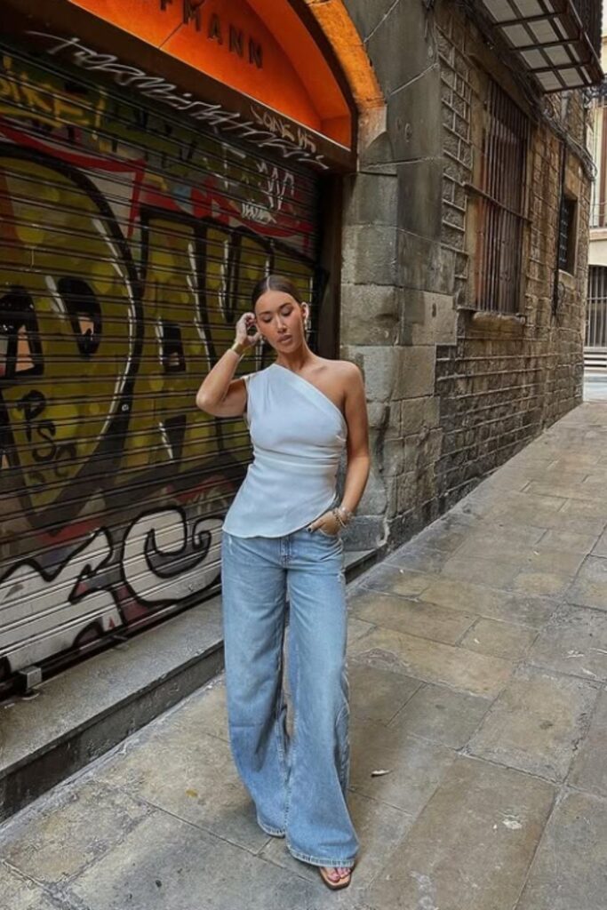 The best Spain outfit ideas for your next vacation—from breezy dresses to chic neutral sets. Get inspired with stylish looks perfect for Mallorca, Marbella, Ibiza, and beyond. Barcelona Spain Outfits, Spain Travel Outfits, Seville Spain Outfits, Spain Style Outfits, Outfits For Spain, Spain Vacation Outfits, Summer In Spain Outfits, Spain Summer Outfit, Madrid Spain Outfit Idea, Spain Jersey Outfit, Mallorca Spain Outfit, Spain Holiday Outfit